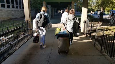 Freshmen Alessia Borzaro and Olivia Ranucci move their belongings out Oct. 17 from their room in McNutt Quad. The quad is one of the living spaces on the northwest side of campus with mold problems.