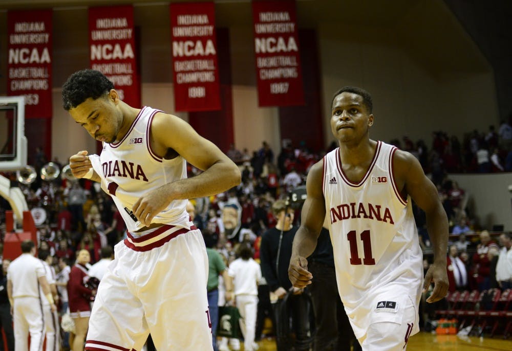 Freshman guard James Blackmon Jr. and junior guard Kevin "Yogi" Ferrell walk off the court after IU's 74-72 loss against Michigan State on Saturday at Assembly Hall. Blackmon Jr. and Ferrell had 21 and 17 points respectively in IU's final game of the season.
