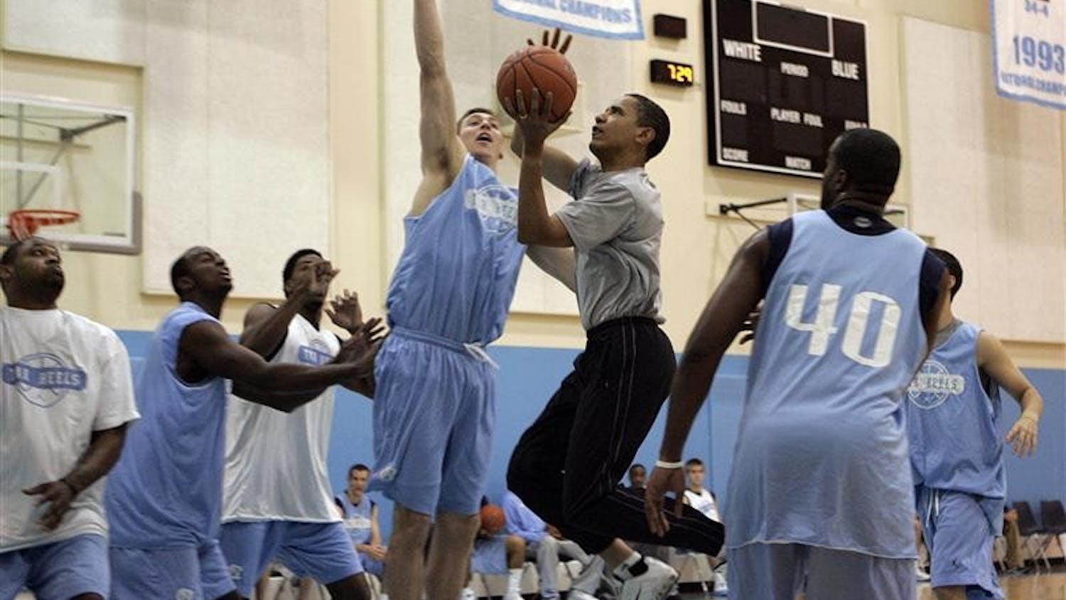 Then Democratic presidential hopeful Sen. Barack Obama, center right, driving to the basket against the University of North Carolina's Tyler Hansbrough during a game April 29 in Chapel Hill, N.C.
