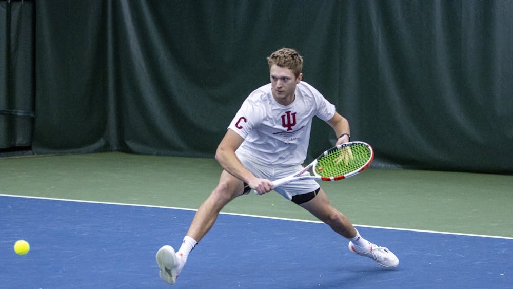 Senior Carson Haskins attempts to return a serve against Princeton University on Feb. 6, 2022, at the IU Tennis Center. Indiana went 0-2 over the weekend against East Tennessee State University and Middle Tennessee State University.