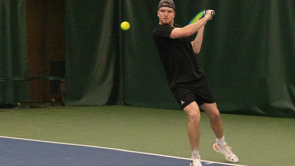Indiana University senior Patrick Fletchall sets up return a serve. Fletchall came out with a win against Southern Indiana on Feb. 12, 2023 at the IU Tennis Center. Indiana won the match 4-0.