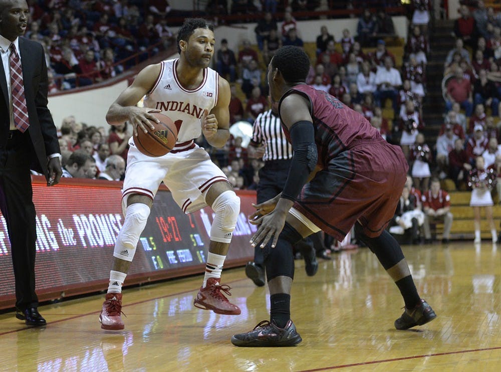 Freshman James Blackmon Jr. dribbles the ball while guarded during IU's game against Indianapolis on Monday at Assembly Hall.