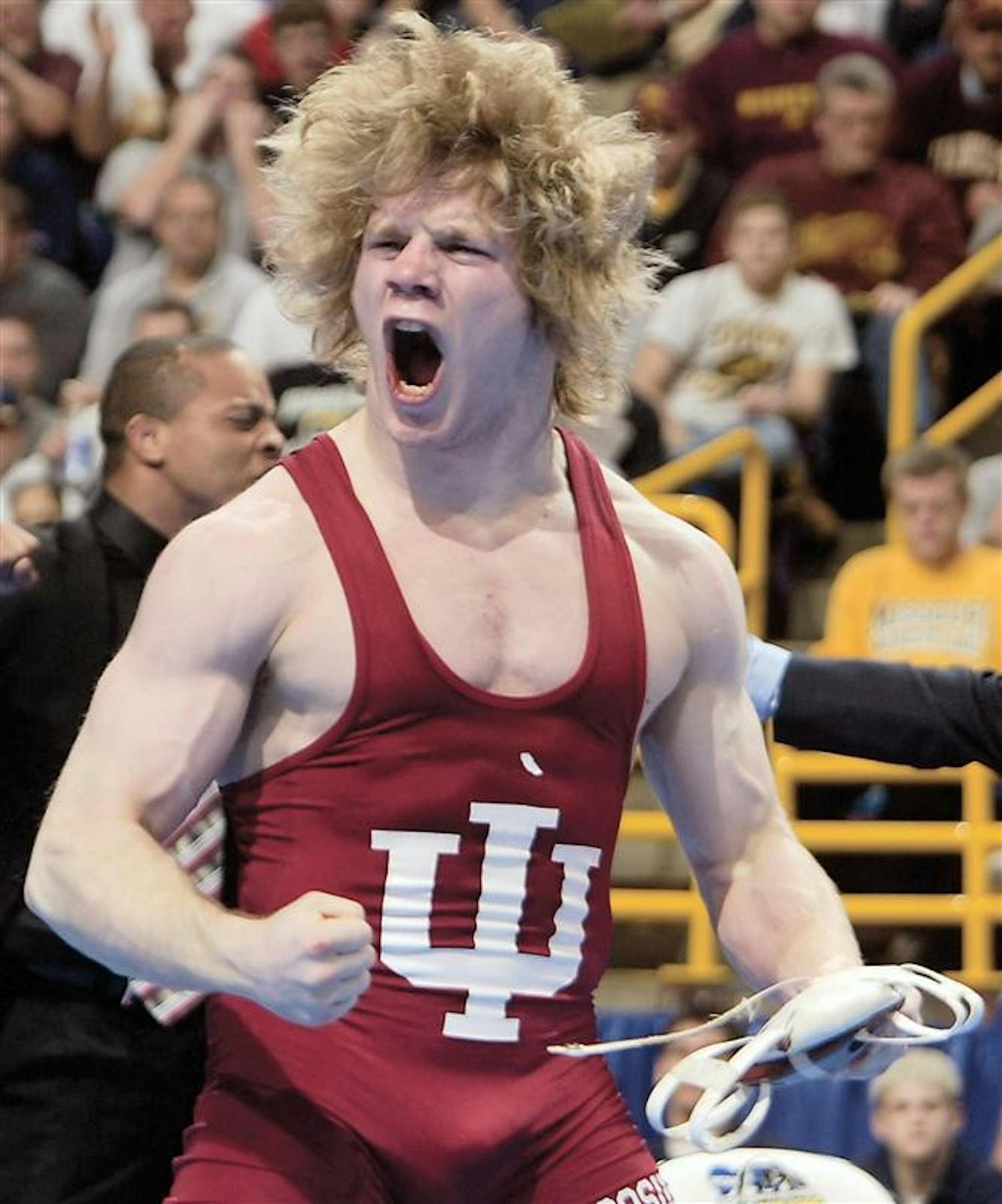 Indiana's Joe Dubuque celebrates after upsetting number one seed Sam Hazewinkel 3-1 in the 125-pound semifinal match Friday, March 18, 2005 at the NCAA Division I wrestling championships in St. Louis. 