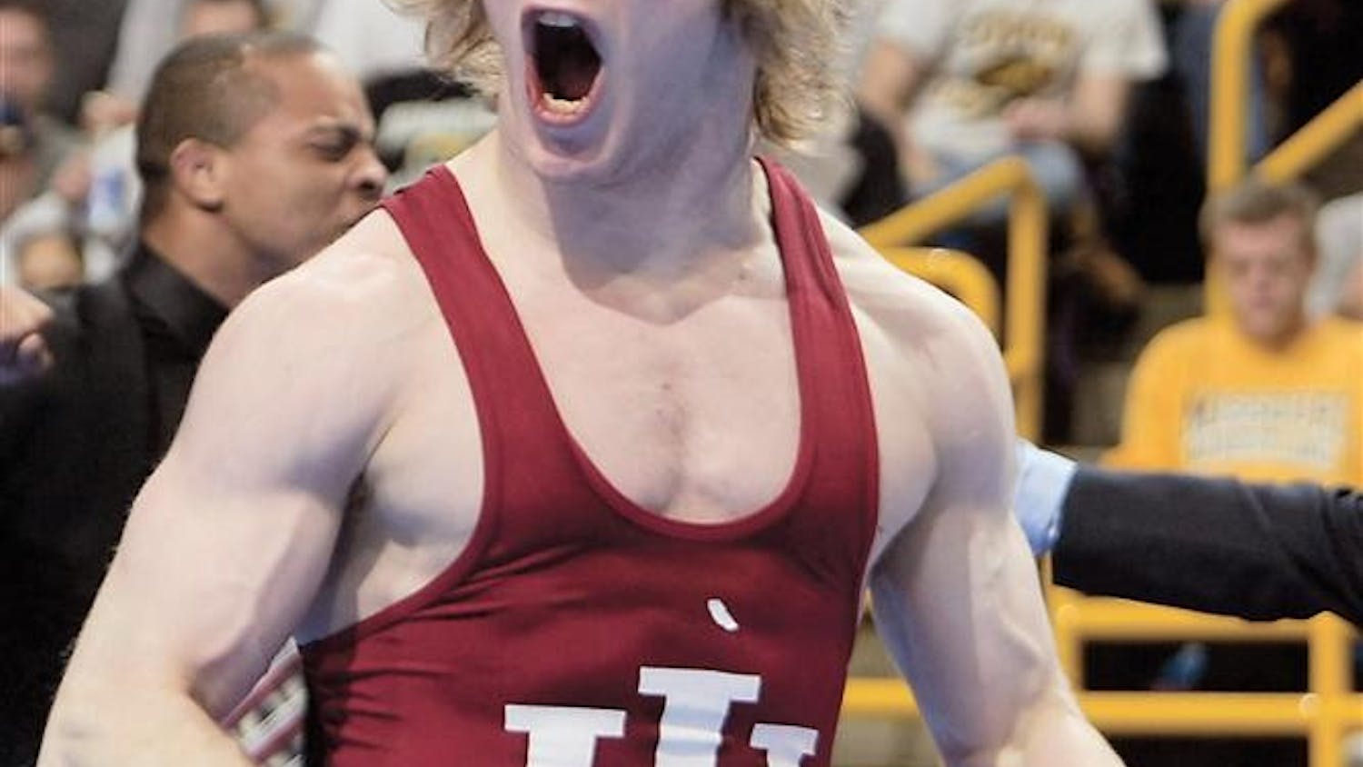 Indiana's Joe Dubuque celebrates after upsetting number one seed Sam Hazewinkel 3-1 in the 125-pound semifinal match Friday, March 18, 2005 at the NCAA Division I wrestling championships in St. Louis.