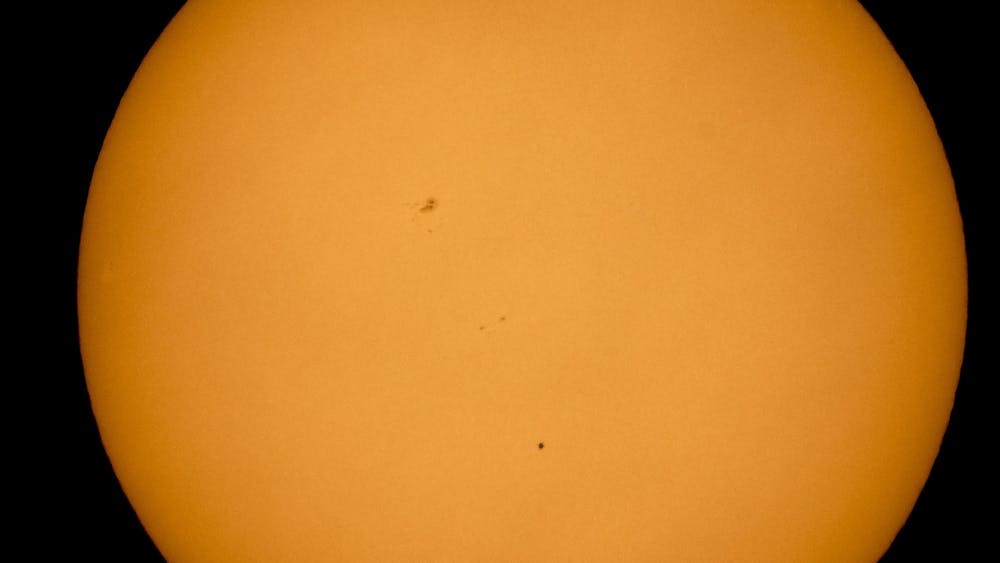 The planet Mercury is seen in silhouette from Boyertown, Pennsylvania, as it transits across the face of the sun May 9, 2016.