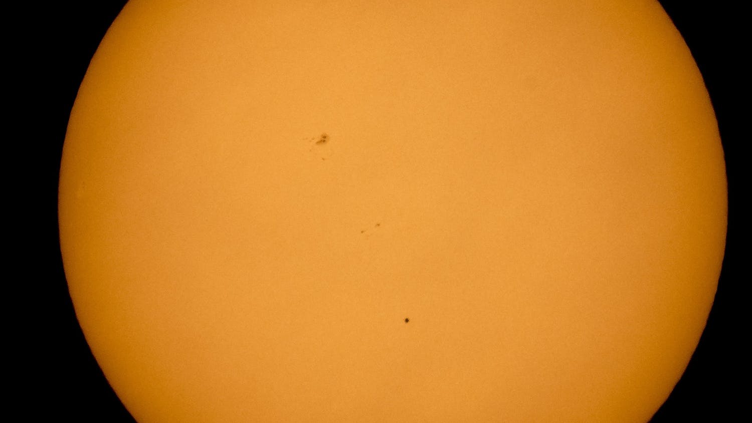 The planet Mercury is seen in silhouette from Boyertown, Pennsylvania, as it transits across the face of the sun May 9, 2016.