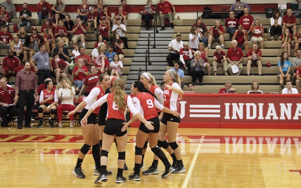 The Indiana Hoosiers cheers as they successfully earn a point during the volleyball competition against the Northwestern on Wednesday.
