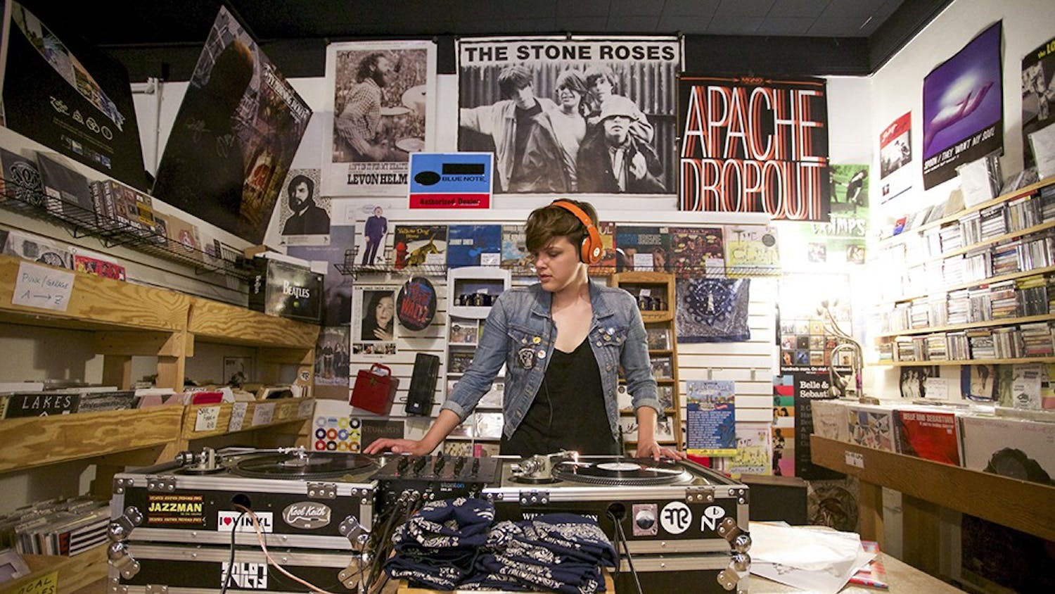 DJ Ann Jonker plays LPs on April 19, 2015, during the Record Store Day celebration at Landlocked Music. The store will celebrate Record Store Day on April 13 with live music and exclusive vinyl releases. ﻿