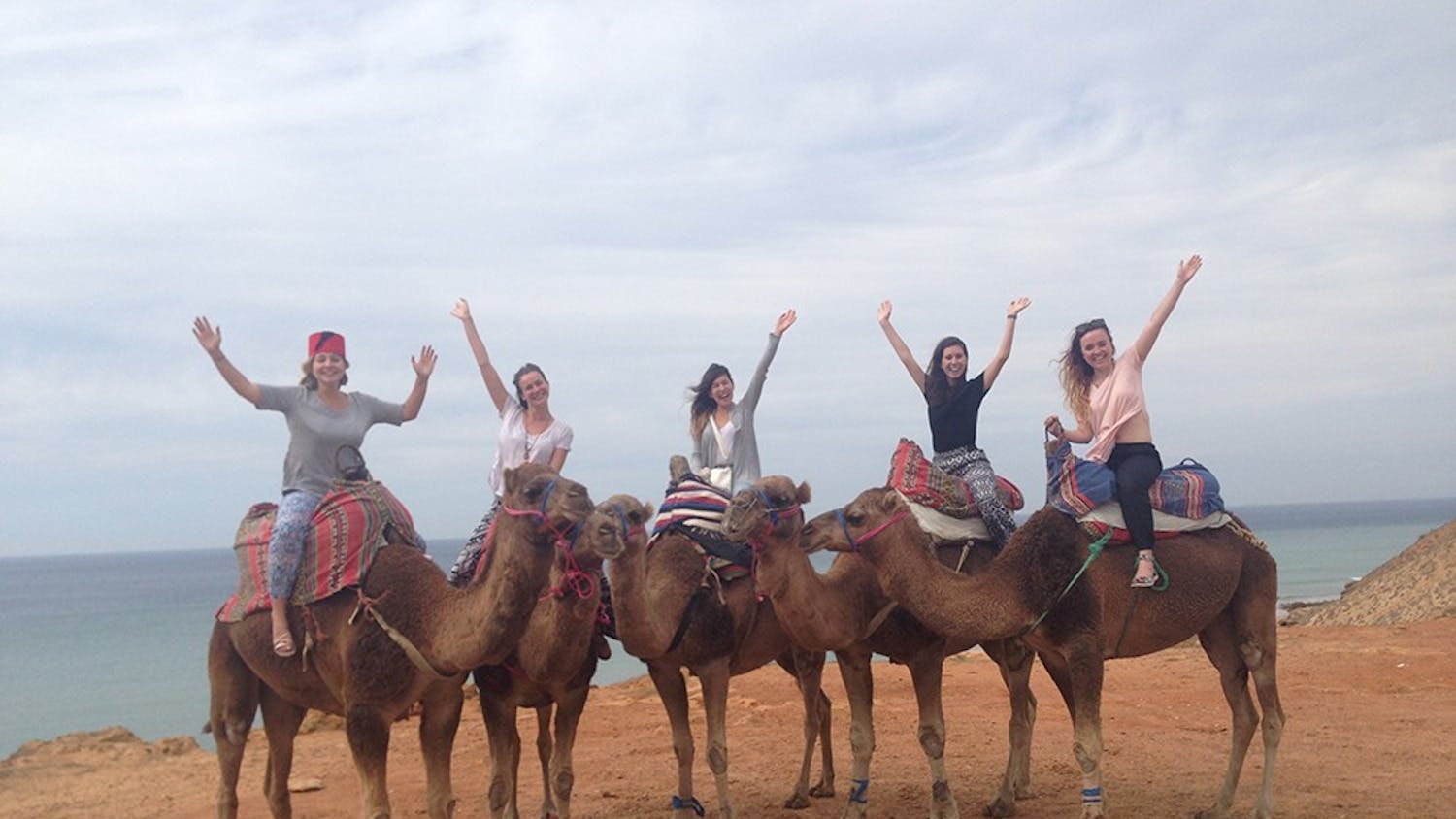 Alongside their Moroccan host student, Yousra Alami, columnist Lauren Saxe and fellow study abroad student Michelle Dunham say goodbye during their last breakfast in Chefchaouen. Five Moroccan students hosted trios and pairs of study abroad students from Seville, Spain.
