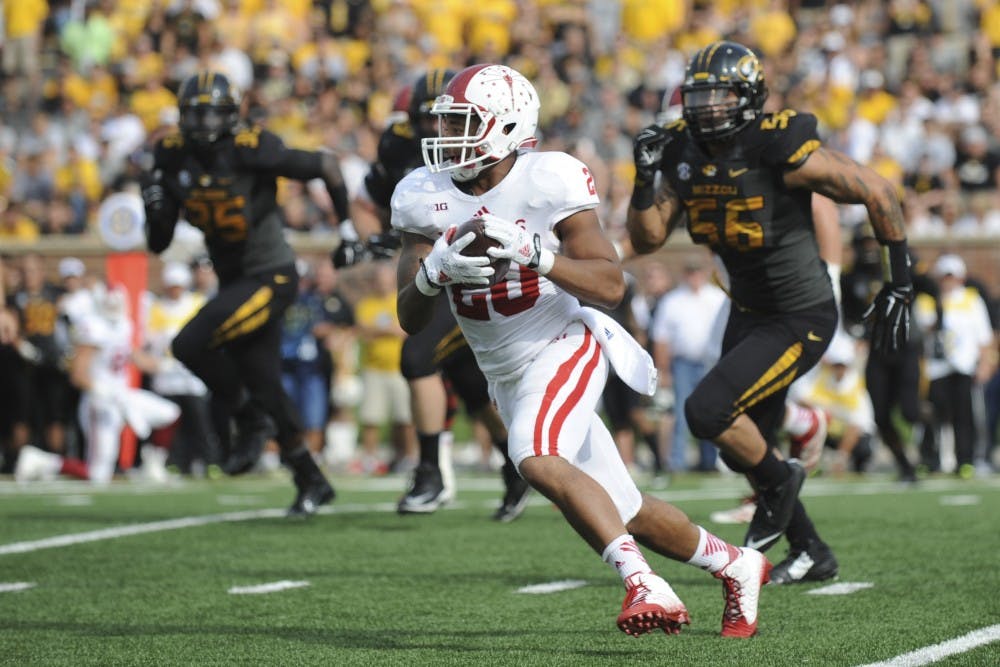 Senior running back D'Angelo Roberts runs with the ball during IU's game against Missouri on Saturday at Faurot Field in Columbia Mo.