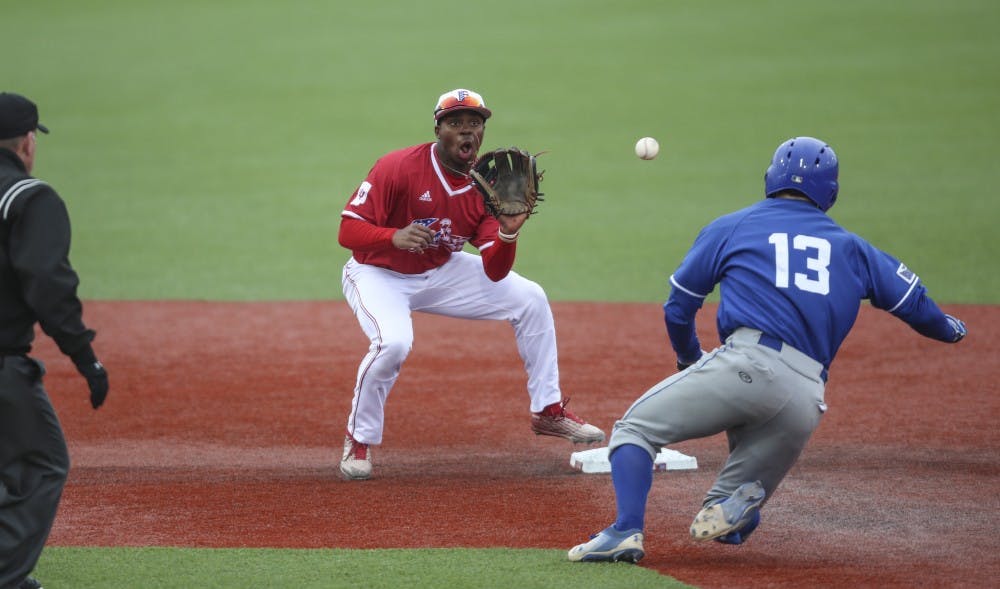 <p>Sophomore Jeremy Houston catches the ball to tag the out during the Hoosiers' game against the Indiana State Sycamores. IU will play Illinois Wednesday night in the Big Ten Tournament.&nbsp;</p>