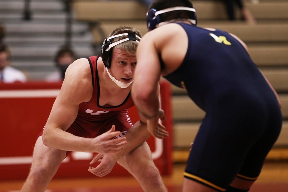 IU senior Taylor Walsh takes on Michigan sophomore Taylor Massa in the 165 lb. weight class during Sunday's wrestling match at University Gym. 