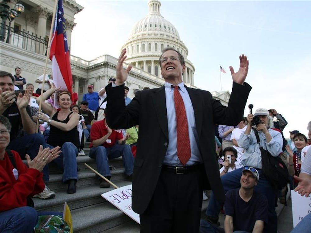 Rep. Jack Kingston, R-Ga., speaks to people demonstrating against the health care bill on the U.S. Capitol steps a day before Congress is set to vote on health care reform on Saturday on Capitol Hill in Washington.