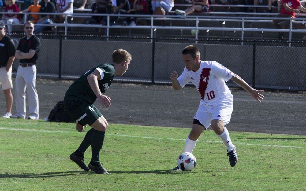 Indiana's Tanner Thompson crosses a defender in Sunday afternoon's 2-1 victory over Michigan State at Bill Armstrong Stadium.