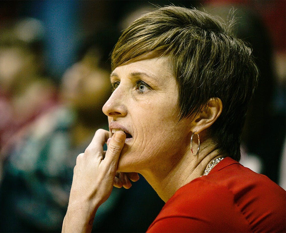 Head coach Teri Moren takes a knee at the edge of the court during the fourth quarter of play on Feb. 4 at Assembly Hall. The Hoosiers held on late to beat the Iowa Hawkeyes 79-74. 