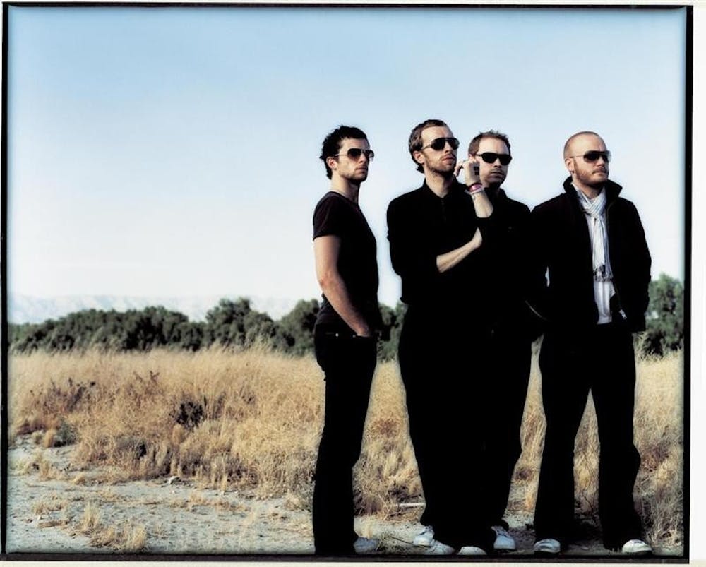 The members of Coldplay are badasses, but not too badass to stand in a prairie.
