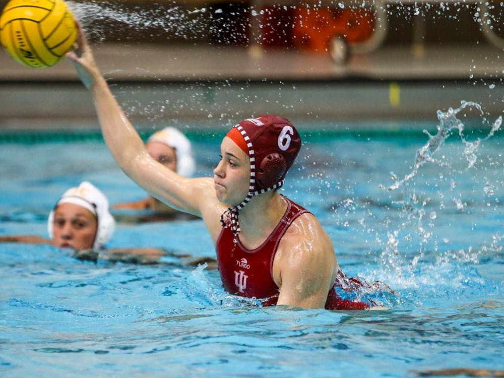 Sophomore attacker Lanna Debow throws the ball April 2 at the Counsilman Billingsley Aquatics Center. IU water polo lost both of its matches with No. 4 University of California, Berkeley this weekend.