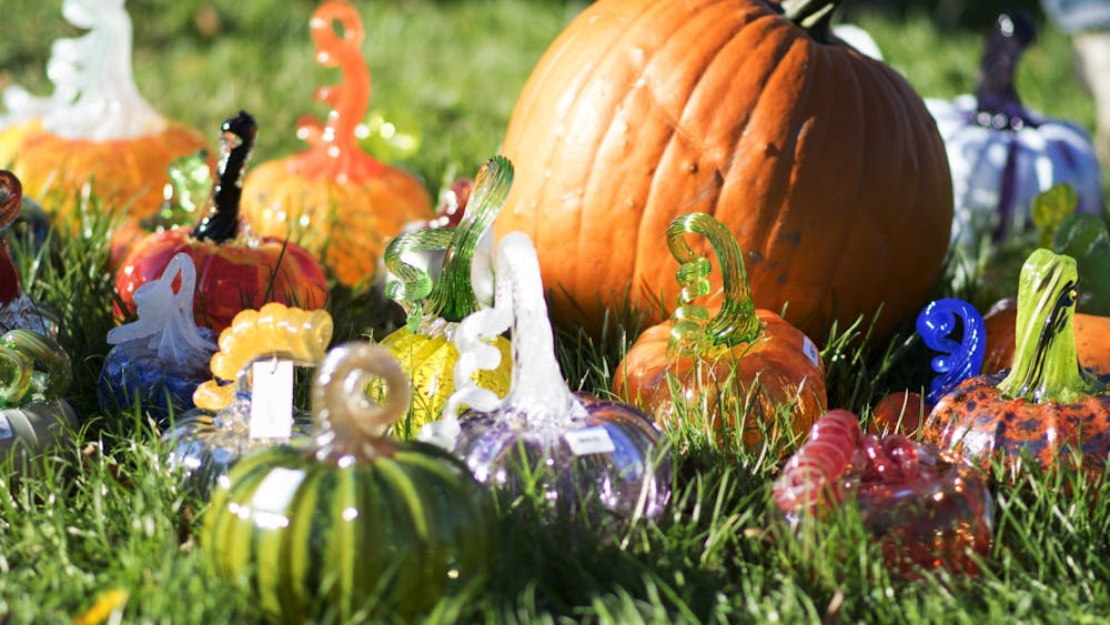 Pumpkins rest on the lawn of the Monroe County Courthouse on Oct. 15, 2017, as part of the Great Glass Pumpkin Patch. The Bloomington Creative Glass Center creates more than 900 glass pumpkins to sell each year, with proceeds going to support a fully-equipped hot glass arts education center in Bloomington.
