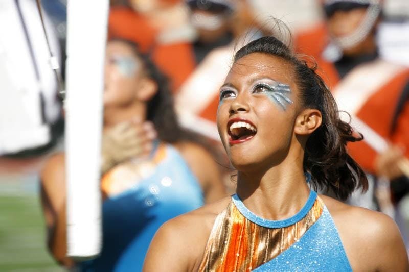 A colorguard member for the Mandarins Drum and Bugle Corps tosses her rifle during the group's DCI Quarterfinal performance Tuesday afternoon at Memorial Stadium.