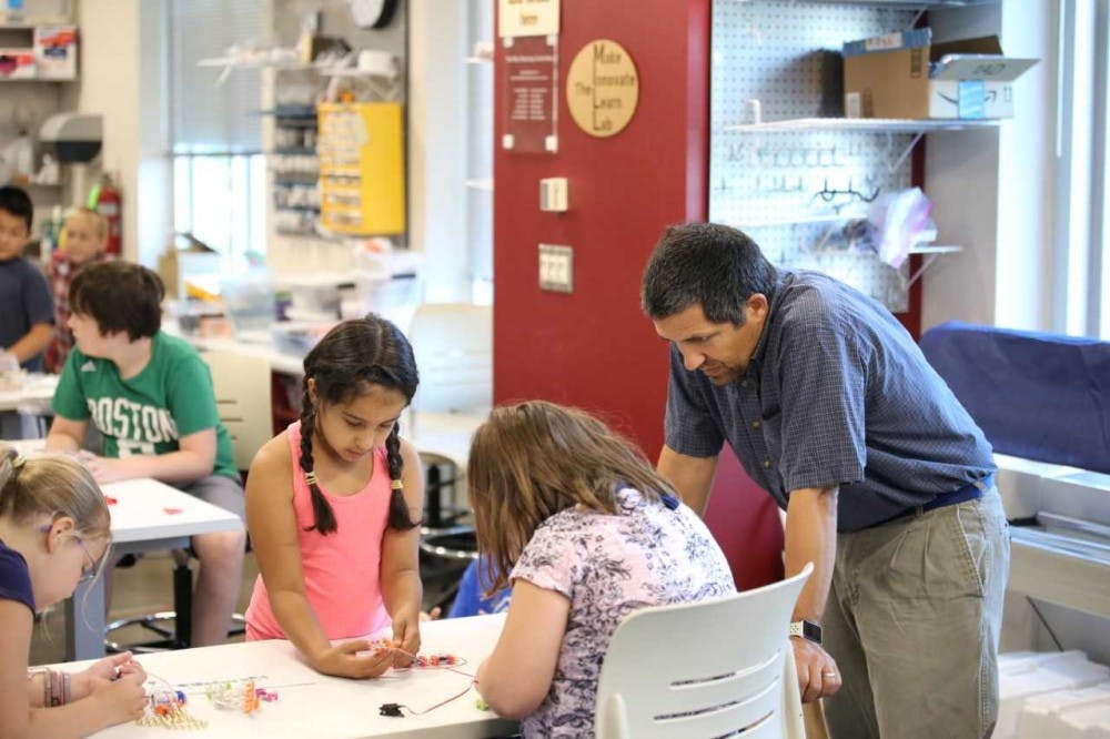 <p>Adam Maltese, an&nbsp;associate professor of science education, works with students at the&nbsp;Make, Innovate, Learn Lab Makerspace. Maltese is studying how women and young girls first get interested in STEM careers.</p>