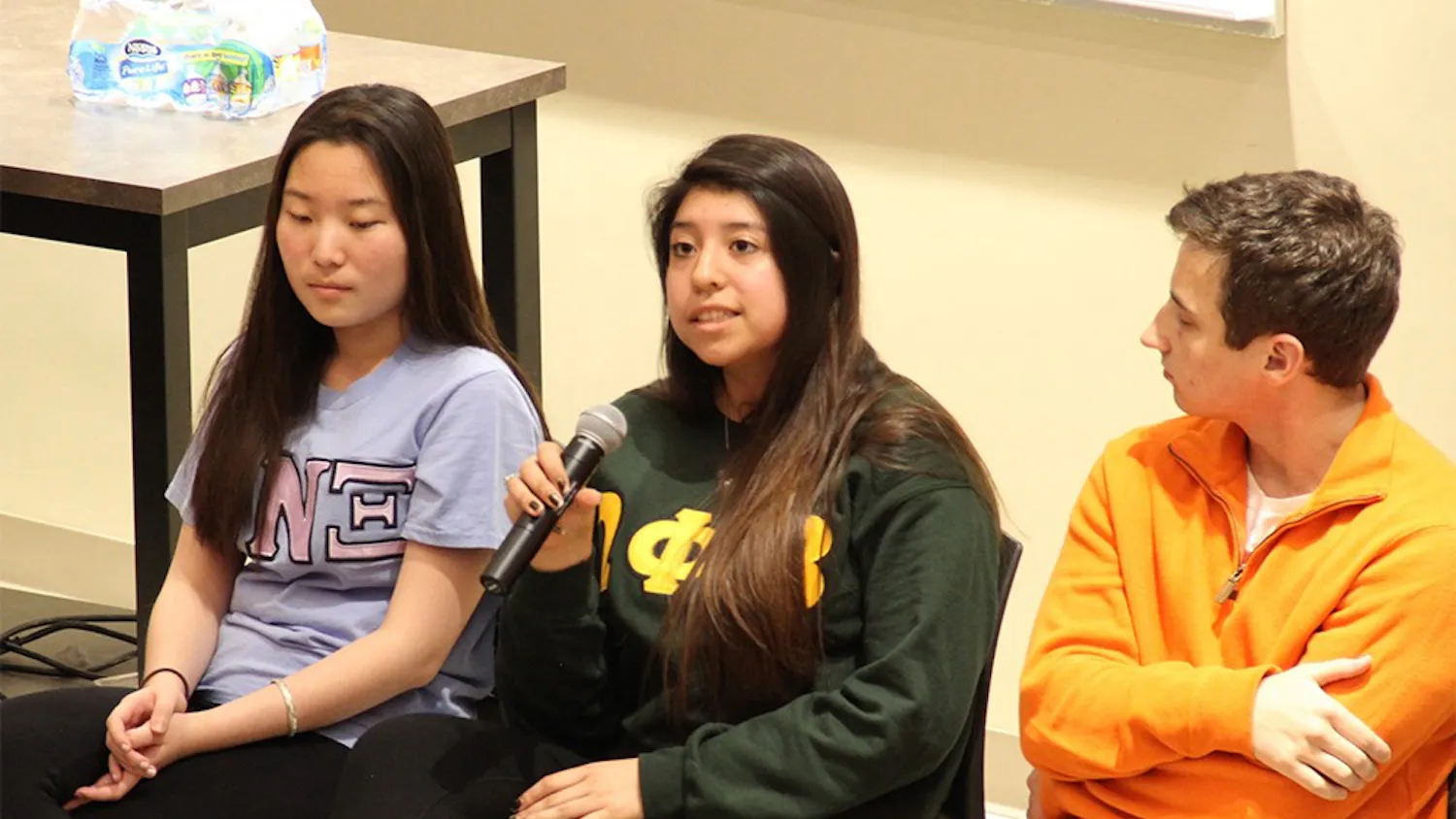 Anahy Mayorga, middle, from the Omega Phi Beta Multi-Cultural Greek Council (MCGC), talks about the roles of MCGC at IU on Wednesday.