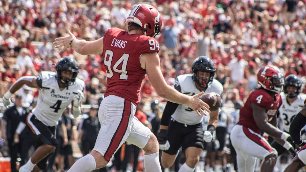 Then-freshman punter James Evans punts the ball against the University of Cincinnati on Sept. 18, 2021, at Memorial Stadium. Evans was named to Ray Guy Award Watch List Wednesday. 