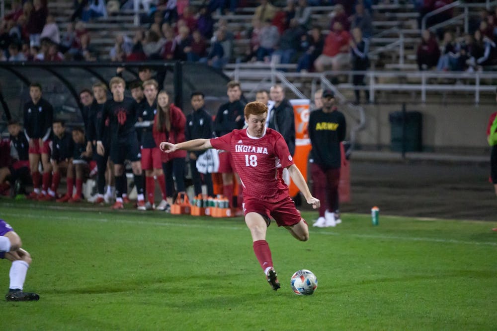 Junior forward Ryan Wittenbrink winds up for a shot on goal Oct. 20, 2021 in Bill Armstrong Stadium. Wittenbrink assisted on Tommy Mihalic's golden goal, which gave Indiana the lead in the Big Ten standings.