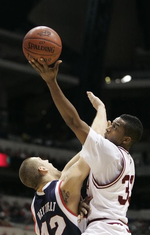 Junior guard Devan Dumes drives toward the basket against Gonzaga senior forward Josh Heytvelt during IU's 70-54 loss to Gonzaga on Saturday afternoon at Lucas Oil Stadium in Indianapolis.