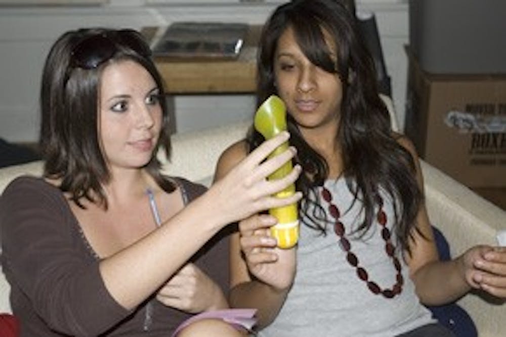 Sara Barlowe and Shilpa Jindia feel good vibrations from “Lilylicious,” a waterproof vibrator.  Photo by Natalie Avon.