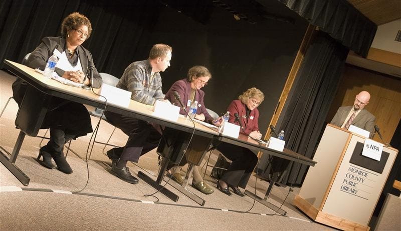 Candidates for Monroe County Circuit Court Judge seats No. 6 and No. 9 speak to the public Monday evening at the Monroe County Public Library.