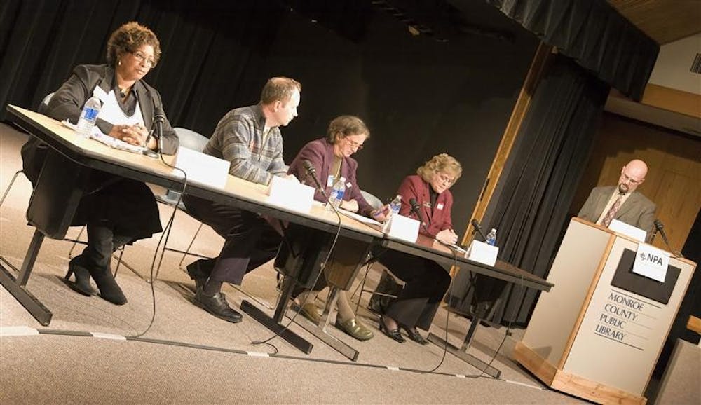 Candidates for Monroe County Circuit Court Judge seats No. 6 and No. 9 speak to the public Monday evening at the Monroe County Public Library.