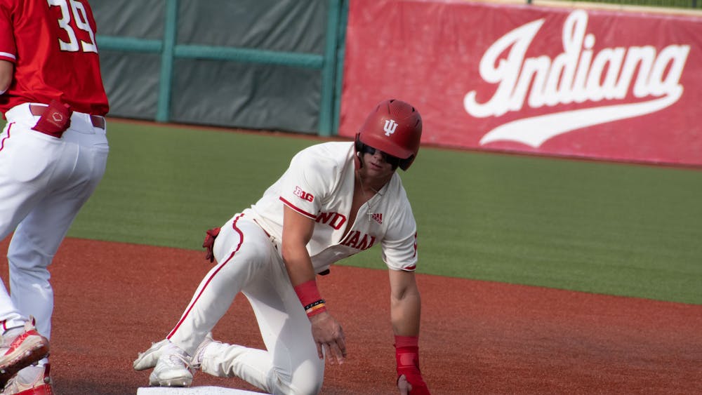 Sophomore designated hitter Carter Mathison slides to first April 28, 2023, against Maryland at Bart Kaufman Field in Bloomington. Indiana swept Northwestern over the weekend.