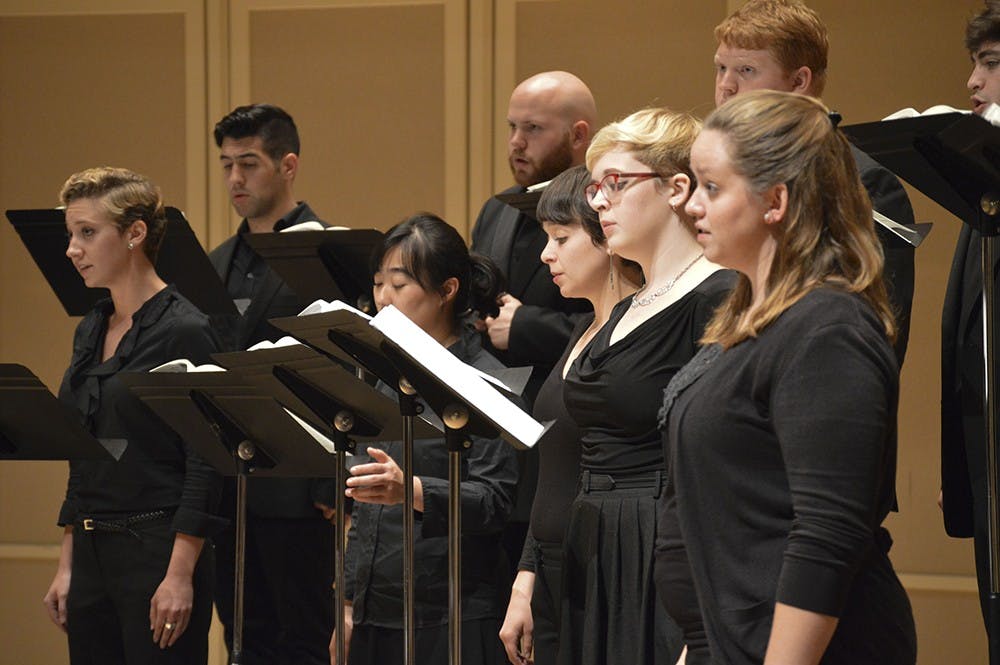 IU vocalists watch the conductor at a recital by Notus, IU's Contemporary Vocal Ensemble. The concert began at 8 p.m. Wednesday in Auer Hall inside the Jacobs School of Music. 
