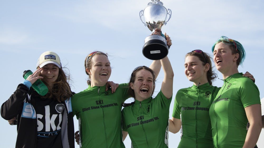SKI cycling team hold up its trophy after the women’s Little 500 race April 12 at Bill Armstrong Stadium. SKI earned third place behind Teter and Delta Gamma. 