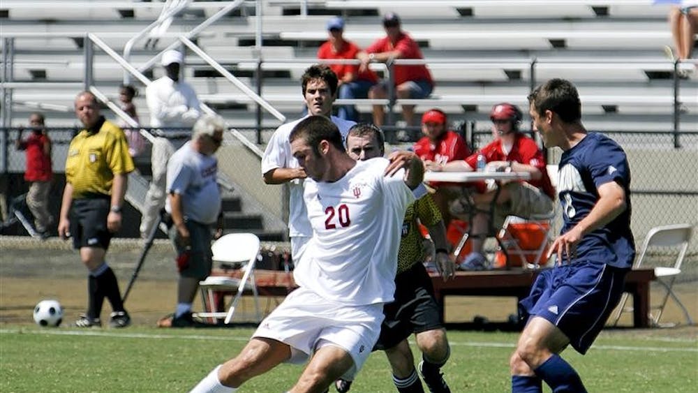 IU freshman Will Bruin crosses the ball against Akron on Aug. 31.  Bruin is one of five Hoosiers and four freshmen who come to Bloomington from the St. Louis area.