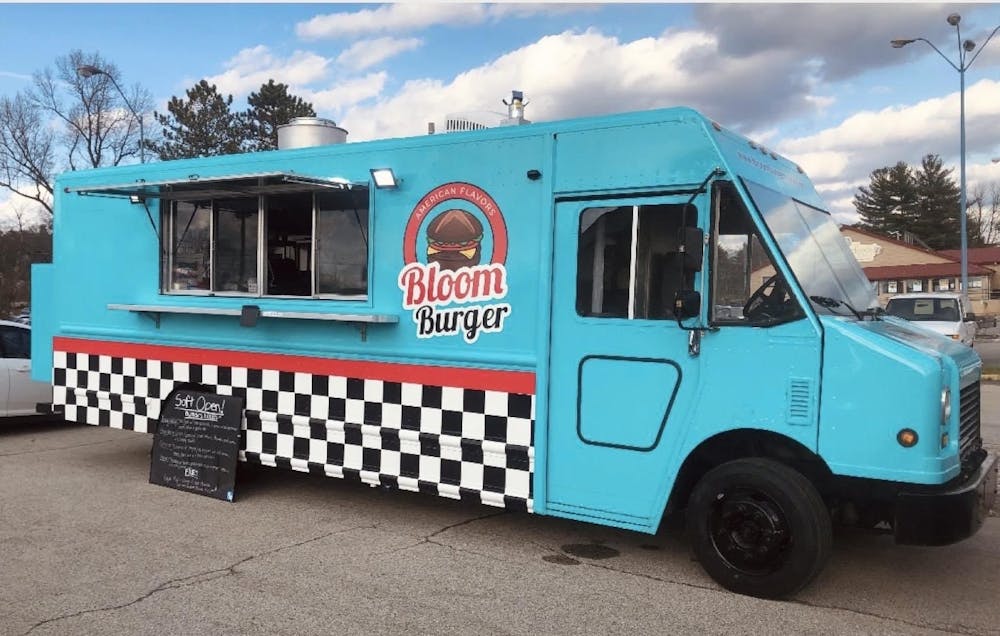 <p>Bloom Burger food truck is pictured in Fifth Third Bank parking lot. Bloom Burger, a food truck featuring a variety of hamburger and fries options inspired by foods from immigrant communities, had its grand opening April 21 at the Primetime Business Expo.</p>
