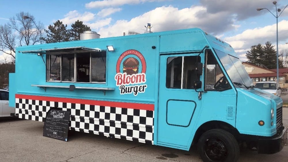 Bloom Burger food truck is pictured in Fifth Third Bank parking lot. Bloom Burger, a food truck featuring a variety of hamburger and fries options inspired by foods from immigrant communities, had its grand opening April 21 at the Primetime Business Expo.