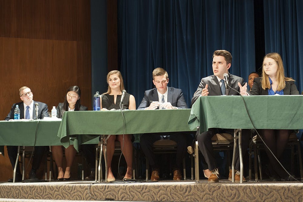 Andrew Ireland (second from right) from UNIFY for IUSA delivering his opening address at the IUSA ticket debate on Thursday evening at the Whittenberger auditorium in the IMU. Three tickets: Amplify for IUSA, INtouch for IUSA and UNIFY for IUSA were present as IU prepares for this year's IUSA elections. The debate was moderated by Bloomington Mayor Mark Kruzan.