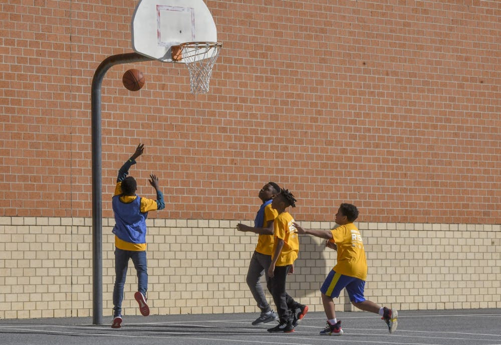 <p>Students play a game of basketball during an after-school program Mach 10 at Murray Hill Middle School in Laurel, Maryland.﻿ Data reports fewer Indiana children are in foster care but more are suicidal.   </p>