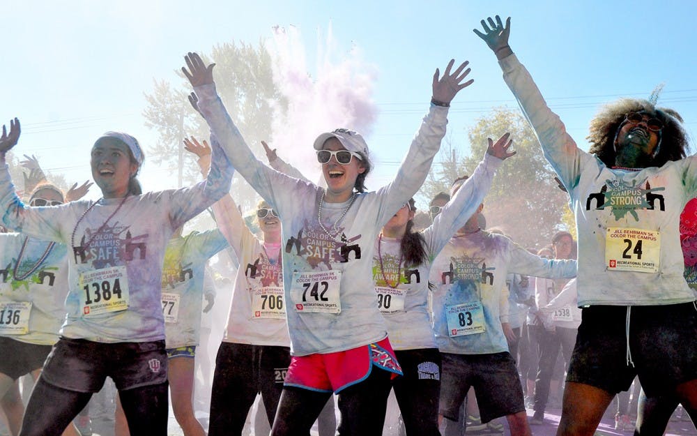 Participants of the JB5k dance to cardio hip hop in the post race party Saturday.