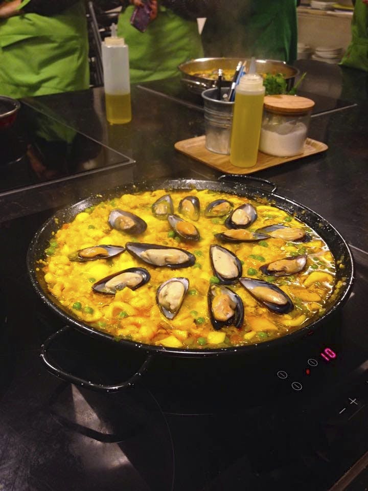 Cooking paella actually looks more like soup. All ingredients, including the rice, are cooked in the same pot.