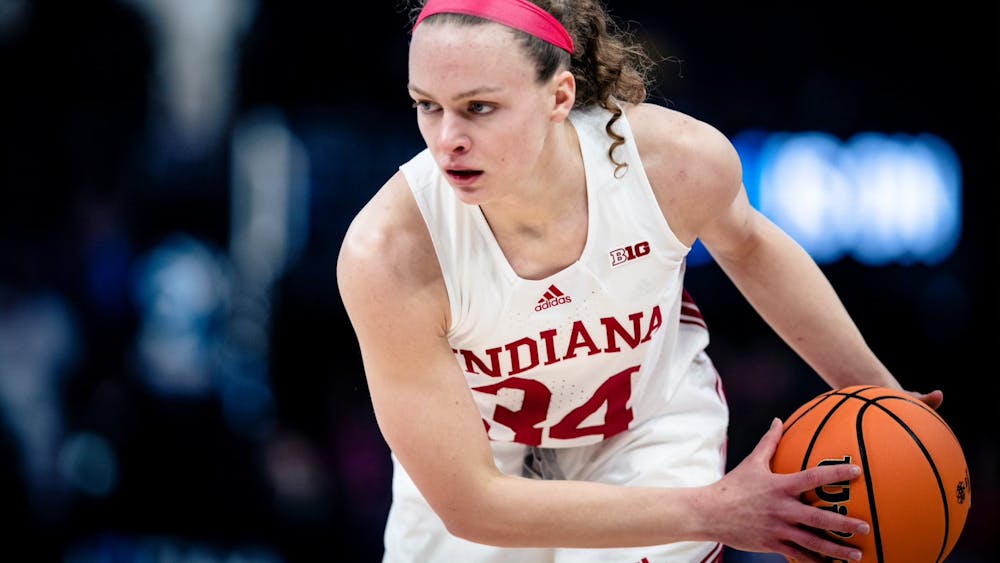 Senior guard Grace Berger holds the ball March 4, 2023, at the Target Center in Minneapolis, Minnesota. Ohio State defeated Indiana 79-75.