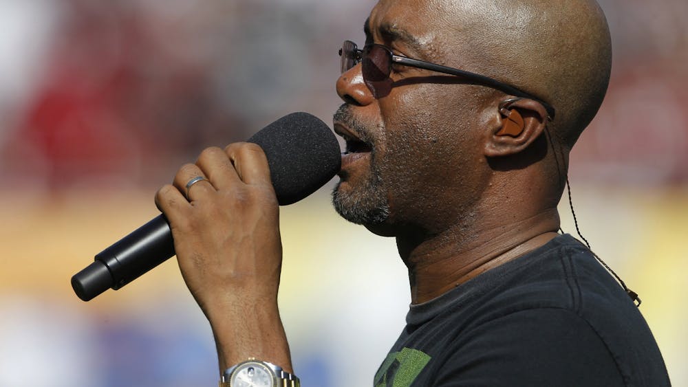 Darius Rucker sings the national anthem prior to the start of the Outback Bowl between University of South Carolina and University of Michigan at Raymond James Stadium in Tampa, Florida, on Jan. 1, 2013. 