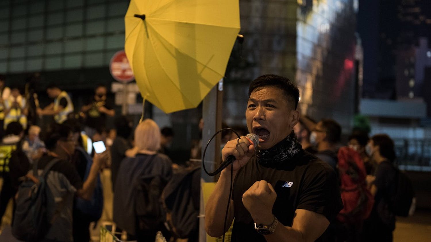 A protester shouts various slogans during a demonstration in Hong Kong. Demonstrators gathered for an anti-authoritarian rally that marked the fifth anniversary of the beginning of the 2014 "Umbrella Movement." Thousands of protesters gathered peacefully, but minor clashes between protesters and police escalated through the night, leading to a police dispersal operation.