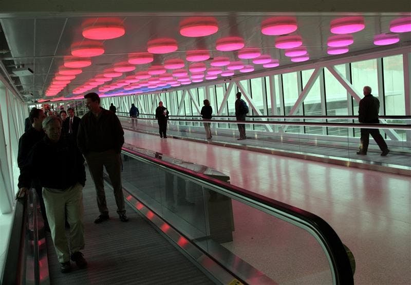 Visitors moving between the parking garages and the terminal are greeted by an overhead display of lights and sound called Interactive Passage at the Col. H. Weir Cook Terminal Building on Tuesday at the Indianapolis International Airport. The new terminal received its first arriving passengers later Tuesday.
