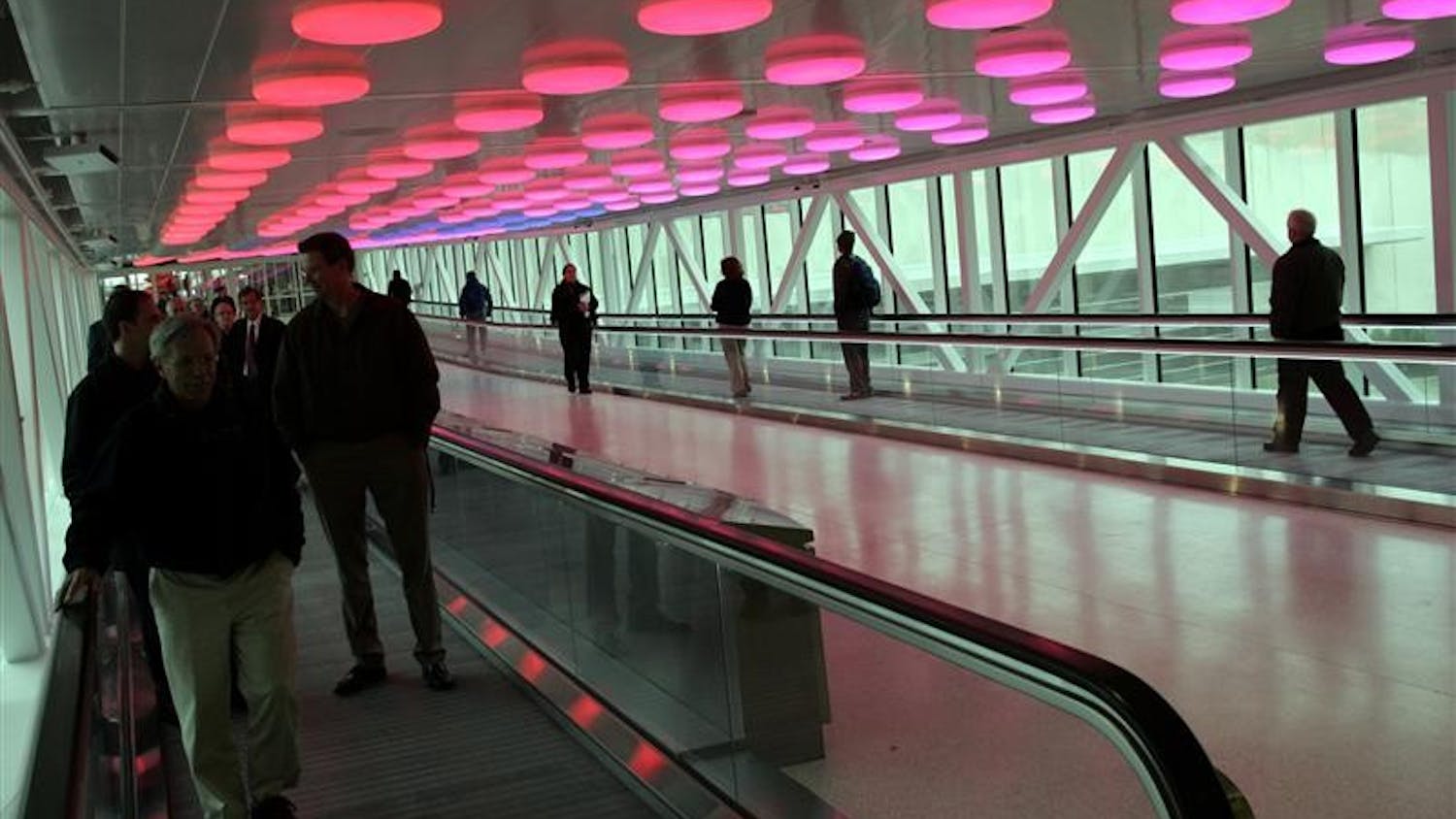 Visitors moving between the parking garages and the terminal are greeted by an overhead display of lights and sound called Interactive Passage at the Col. H. Weir Cook Terminal Building on Tuesday at the Indianapolis International Airport. The new terminal received its first arriving passengers later Tuesday.