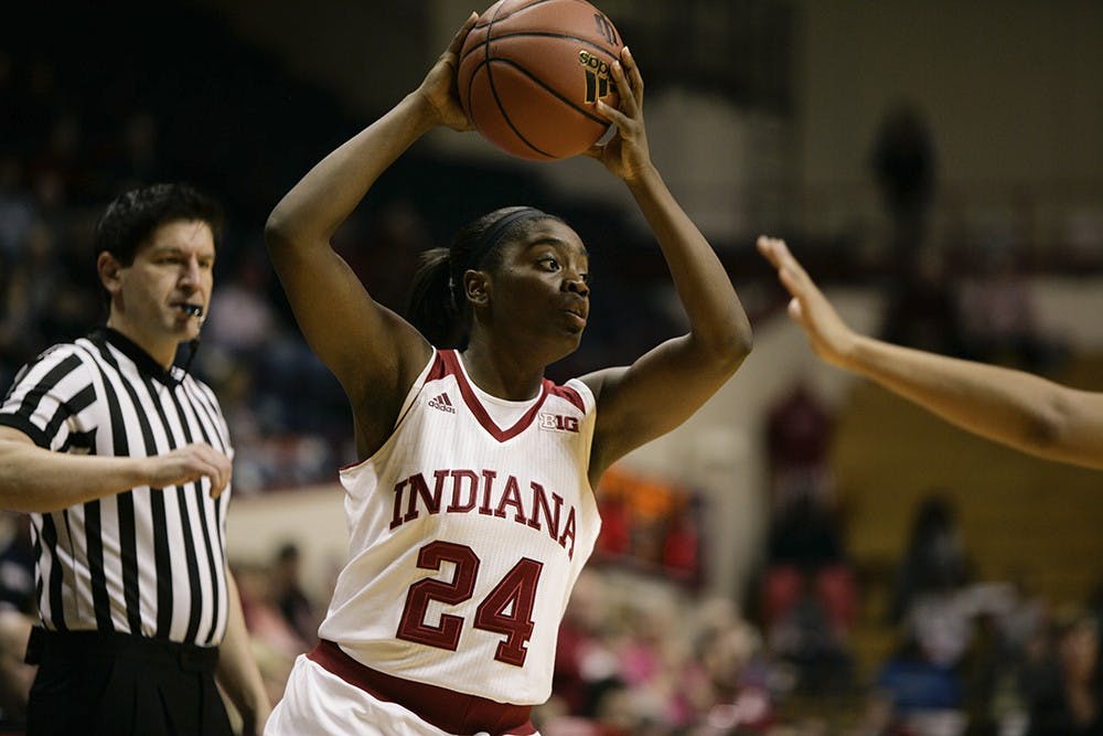 Junior guard Tyshee Towner looks for a teammate to pass the ball to in the opening minutes of the first quarter. 
