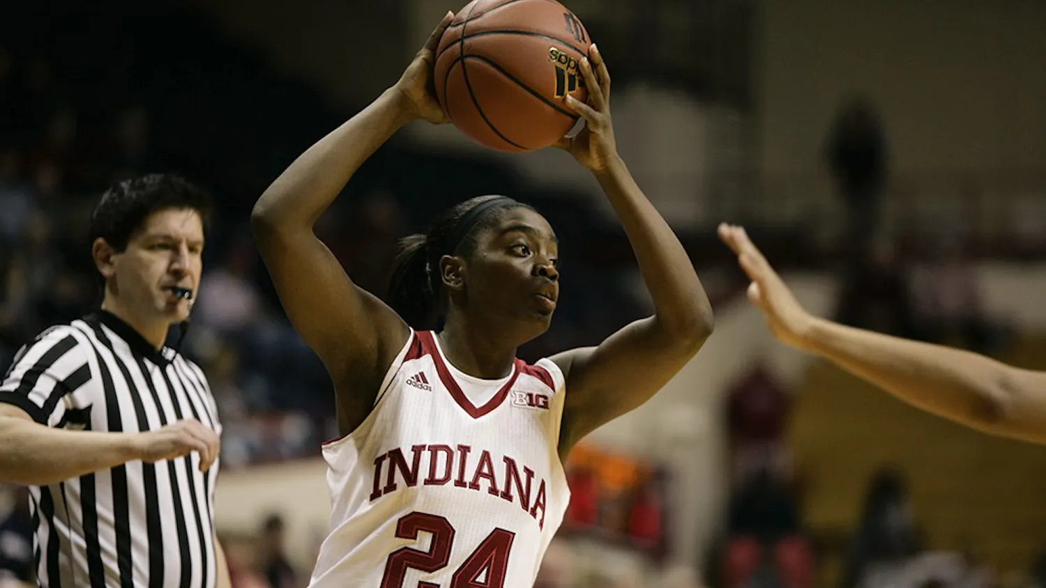 Junior guard Tyshee Towner looks for a teammate to pass the ball to in the opening minutes of the first quarter.