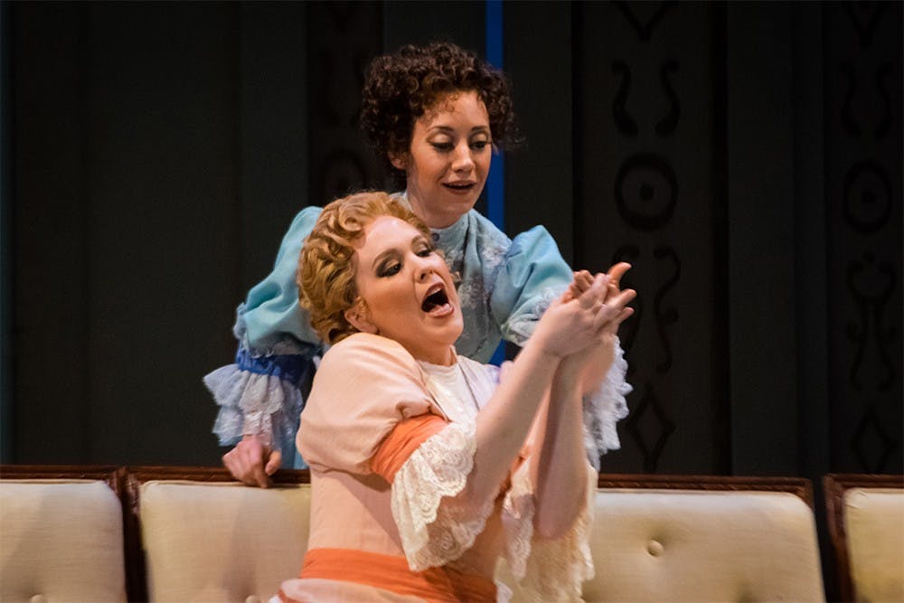 Shannon Love, front, and Rachel Mikol perfom a duet during the Cosi fan Tutte rehearsal Monday at the MAC. Written by Mozart, the Italian opera tells a story of fidelity between two couples.