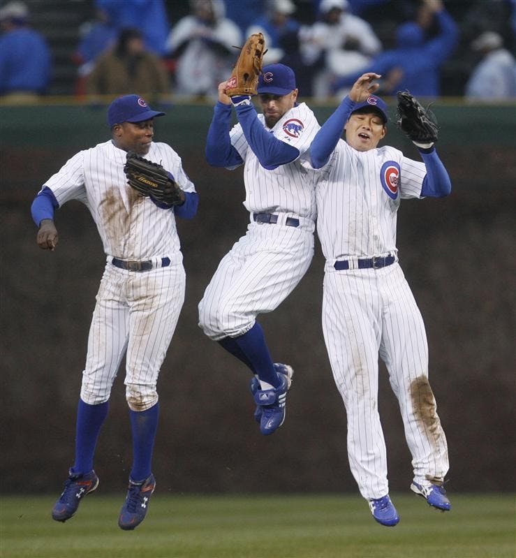 Chicago Cubs outfielders Alfonso Soriano, Reed Johnson, and Kosuke Fukudome celebrate the Cubs' 4-0 win over the Colorado Rockies after a baseball game at Wrigley Field Monday in Chicago. 
